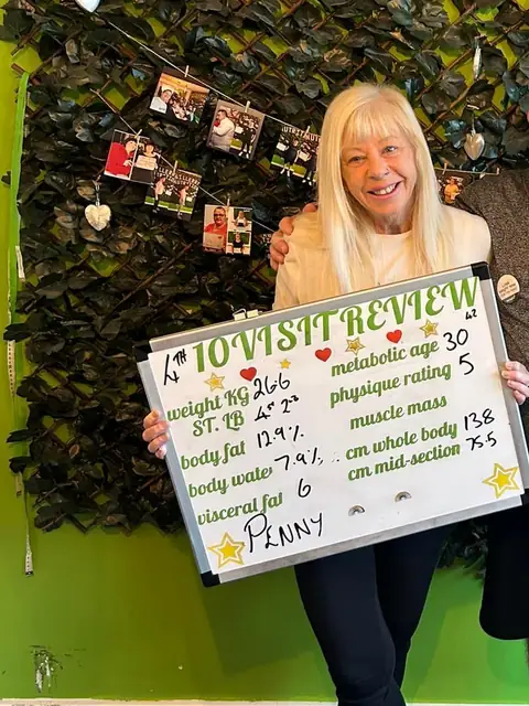 A woman at the Willerby club shows off her assessment board